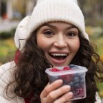 A girl eating berries