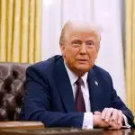 U.S. President Donald Trump speaks to reporters after signing a series of executive orders in the Oval Office of the White House.