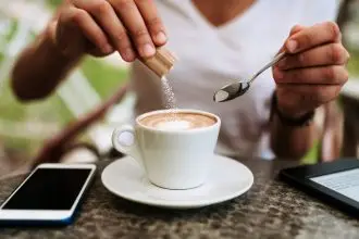 Sugar cubes, brown sugar crystals, granulated white sugar, rock sugar, stevia and honey. Different types of natural sweeteners.