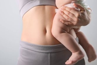 A woman holding a baby