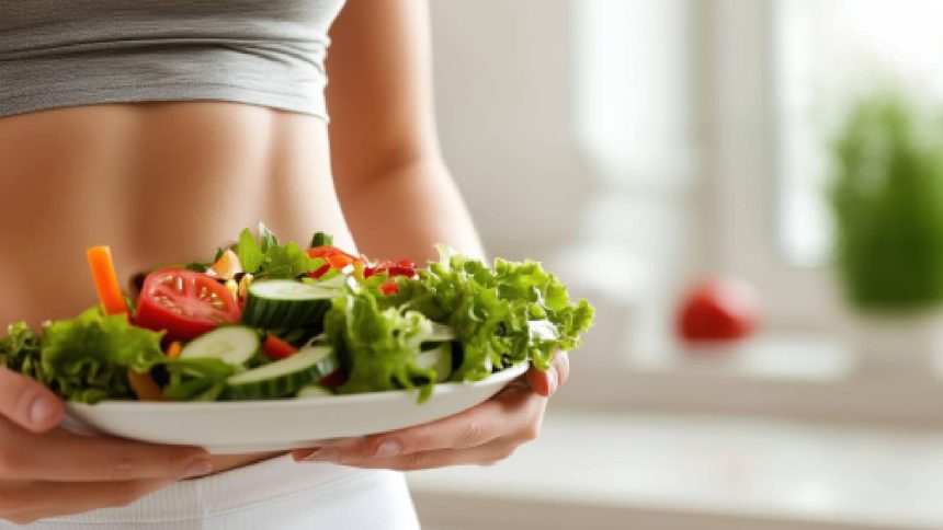 woman holding a plate of healthy food