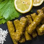 Why do you have to leave the grape leaves part of your meal?