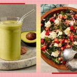 A glass of green smoothie with an avocado on the side a wooden bowl of salad with strawberries and crumbled cheese