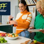Friends preparing a healthy meal in the kitchen.